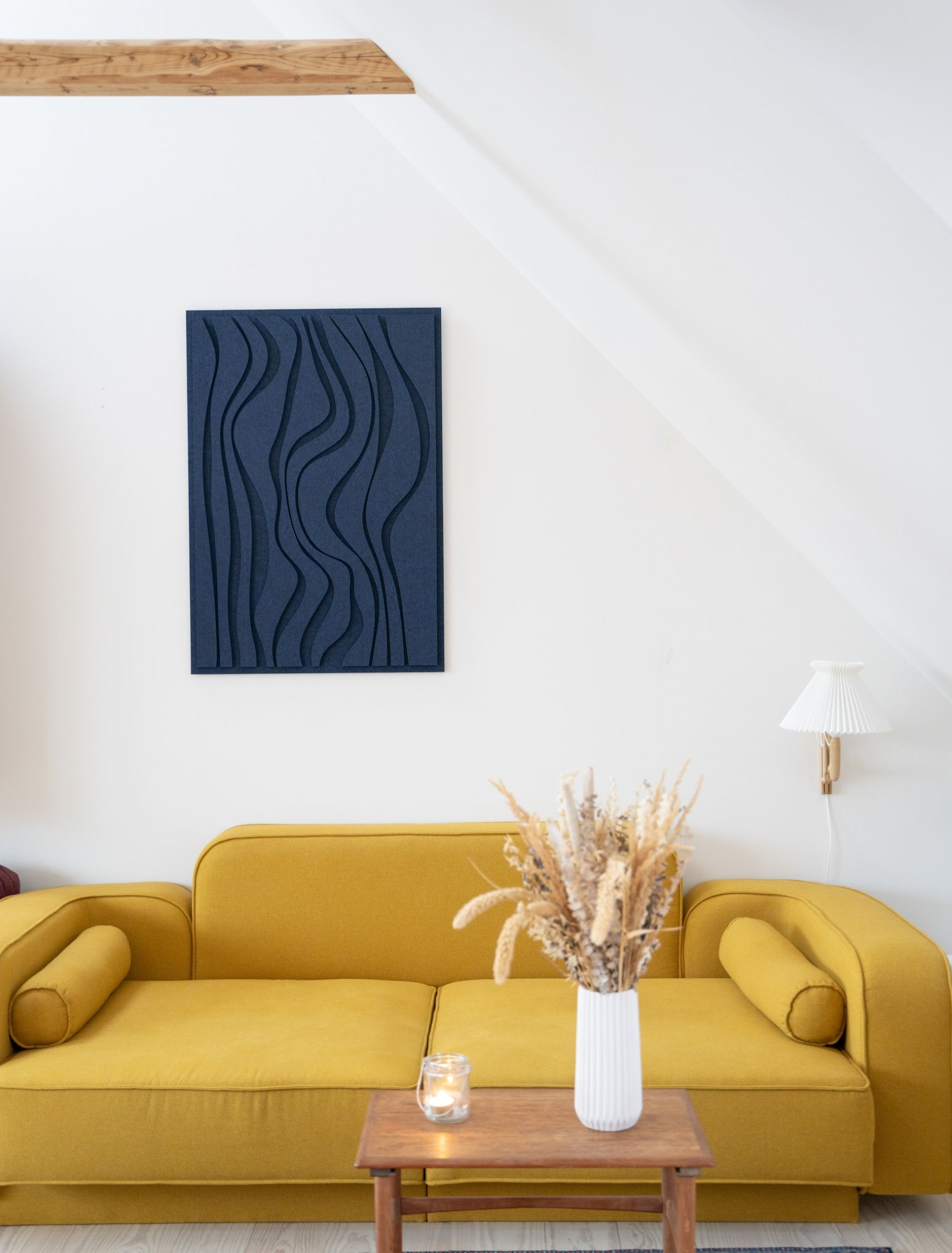 Wave Long Tile acoustic art panels from Arturel displayed in a living room